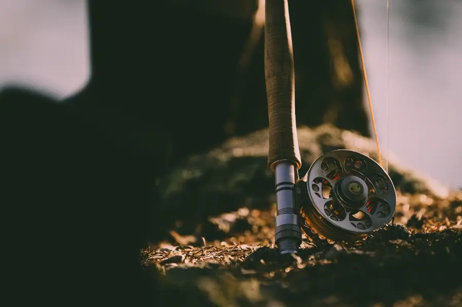 Fly rod and reel resting at the water
