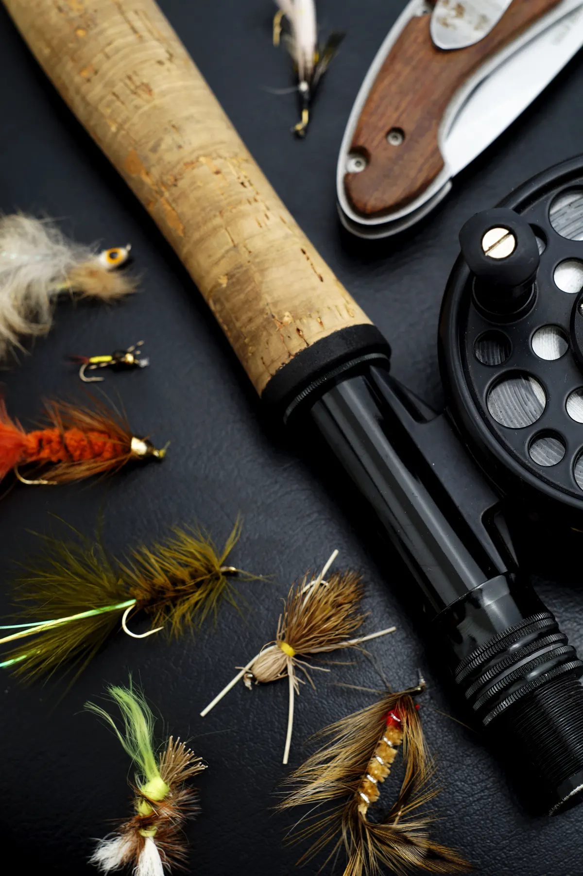 Fly rod, reel and salmon flies laid out